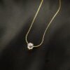 Discover this minimalist clear crystal pendant necklace from Haimee. Crafted from hypoallergenic anti tarnish and water resistant gold plated stainless steel, it's perfect for classic minimalist everyday elegance.