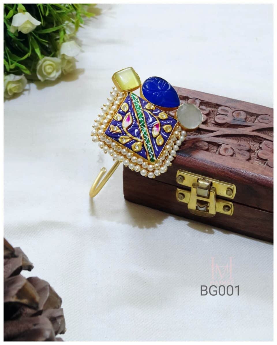 Adjustable gold plated bracelet featuring Tanjore art and pearl details. Statement piece, adds a traditional touch to your look. Shop now!