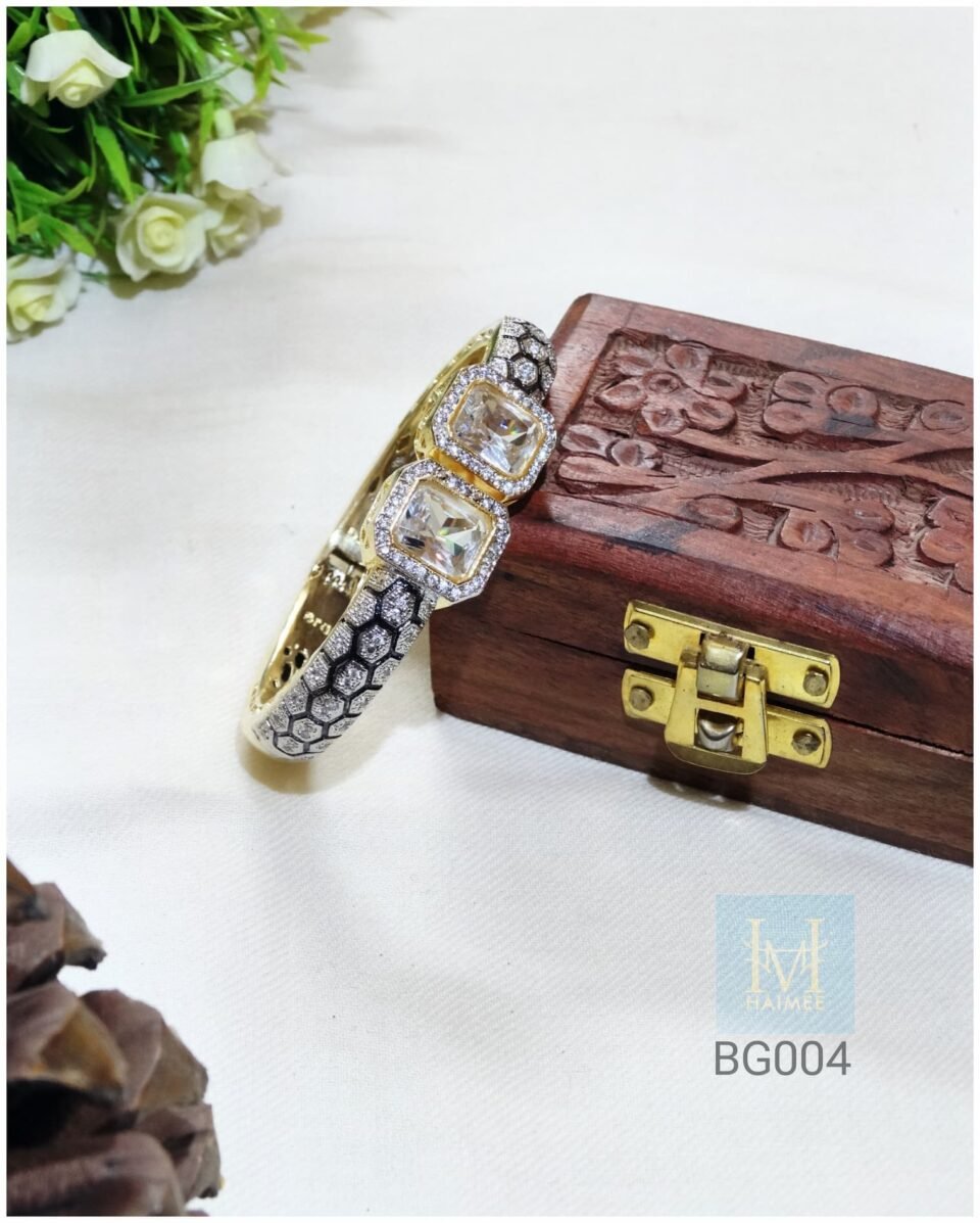 Gold Plated honeycomb bracelet with Zirconia details. Perfect for adding a touch of sparkle to your Indian party look. Shop this unique bracelet now!