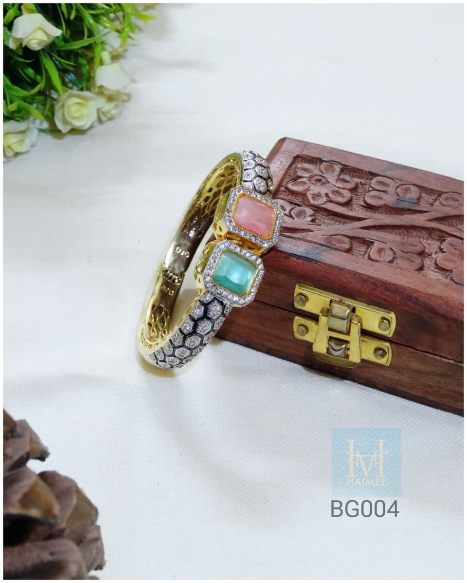 Gold plated honeycomb bangle with Zirconia gemstones. Glamorous party wear, perfect for Indian events. Shop this statement bangle now!