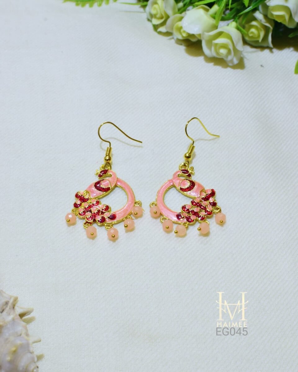 Hand painted peacock drop earrings featuring light pink Meenakari designs and pink bead trim. Gold-plated, artisan crafted. Discover them today!