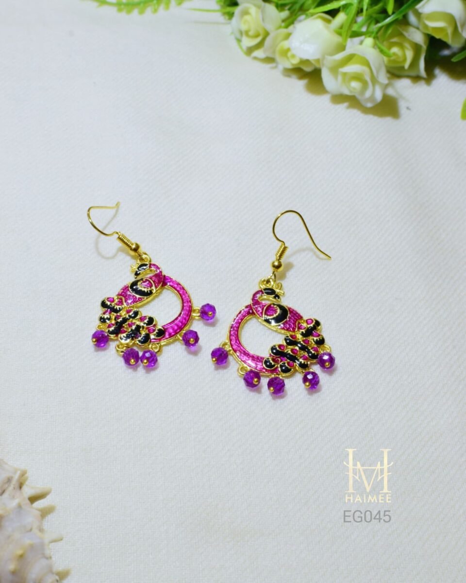 Indian peacock earrings with pink Meenakari and imitation pearl embellishments. Gold- plated, perfect for everyday wear. Discover these unique earrings today!