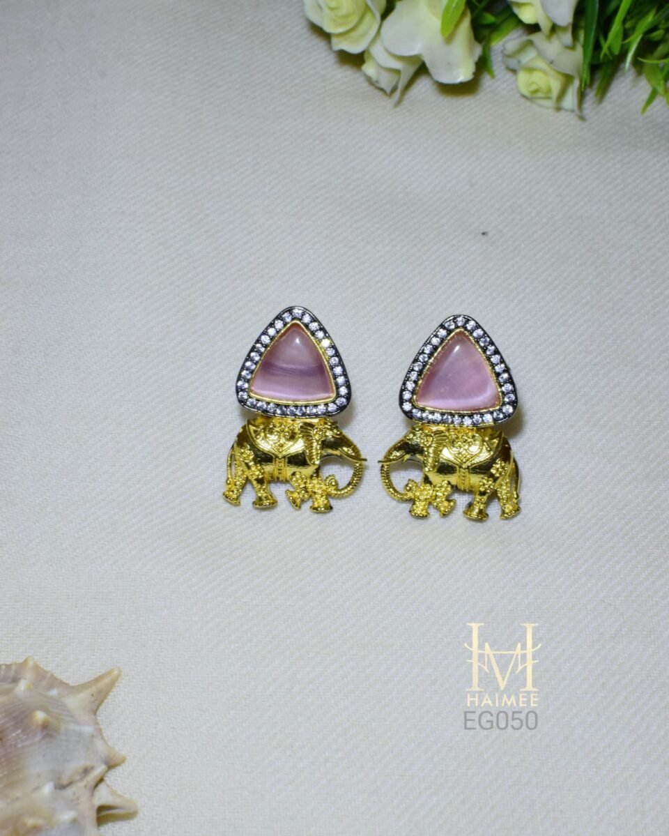Gold plated earrings with Monalisa stone triangles, CZ accents, and elephant motifs. Perfect for cultural events. Shop these handmade ethnic earrings now!