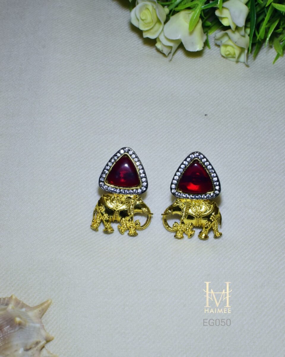Cultural elephant design earrings with unique Monalisa stone triangles and CZ embellishments. Gold plated, perfect for adding an Indian touch to your look.