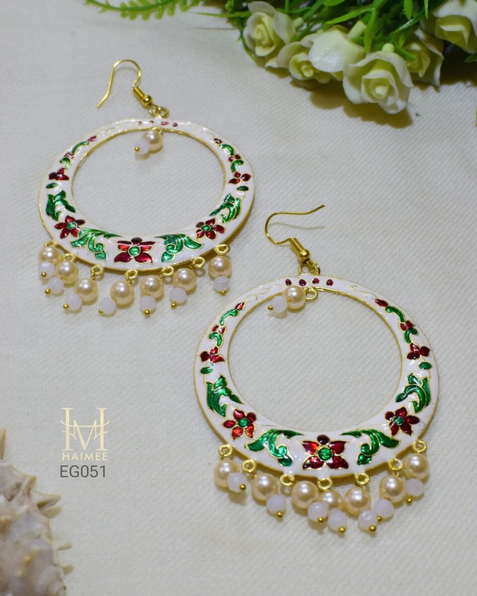 Hand painted white Meenakari hoop earrings chaand baali with floral designs and seed pearl drops. Perfect for festive occasions. Designed for women aged 25-40. Shop now