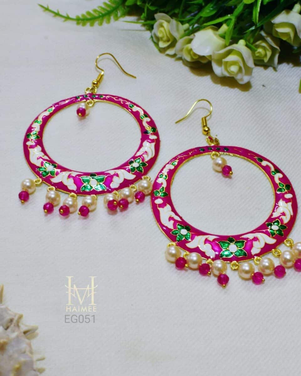 Hand painted pink Meenakari hoop earrings chaand baali with floral designs and seed pearl drops. Perfect for festive occasions. Designed for women aged 25-40. Shop now