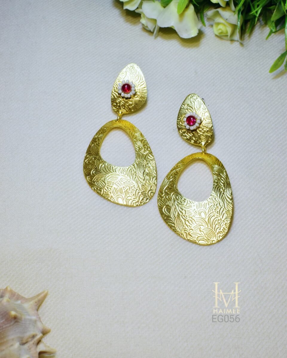 These unique, bohemian style gold earrings with a vibrant red stone are the perfect statement piece. Shop our handcrafted jewelry collection today