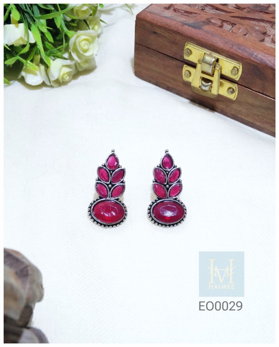 Red stone silver oxidised earrings made of brass