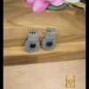 Premium brass Silver oxydised earrings with black stone placed on wooden surface