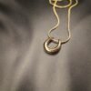 Discover this minimalist horseshoe pendant necklace from Haimee. Crafted from hypoallergenic and water-resistant anti tarnish gold plated stainless steel, it's perfect for unique everyday style.