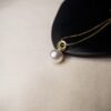 Elevate your everyday style with this polished gold plated anti tarnish round luster seed pearl solitaire necklace. The hypoallergenic, water resistant properties ensure both style and comfort. Shop now
