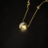 unique gold plated half sphere rope necklace from Haimee. Crafted from anti tarnish stainless steel, its polished finish and minimalist design are perfect for everyday elegance.