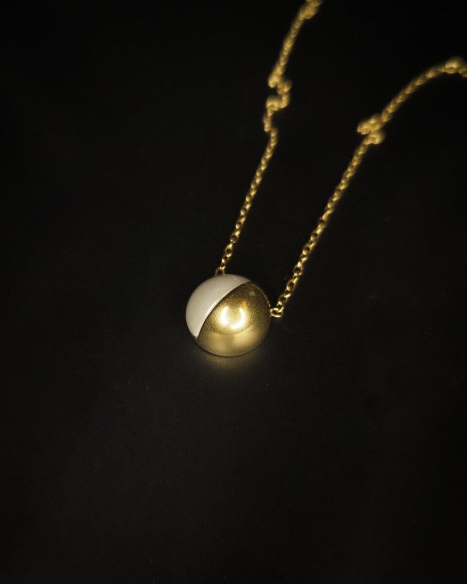 unique gold plated half sphere rope necklace from Haimee. Crafted from anti tarnish stainless steel, its polished finish and minimalist design are perfect for everyday elegance.