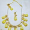 Handmade yellow Monalisa necklace with trapezoid stones and gold Meenakari work. Perfect for parties. Pearl bead base. Shop this unique set for women