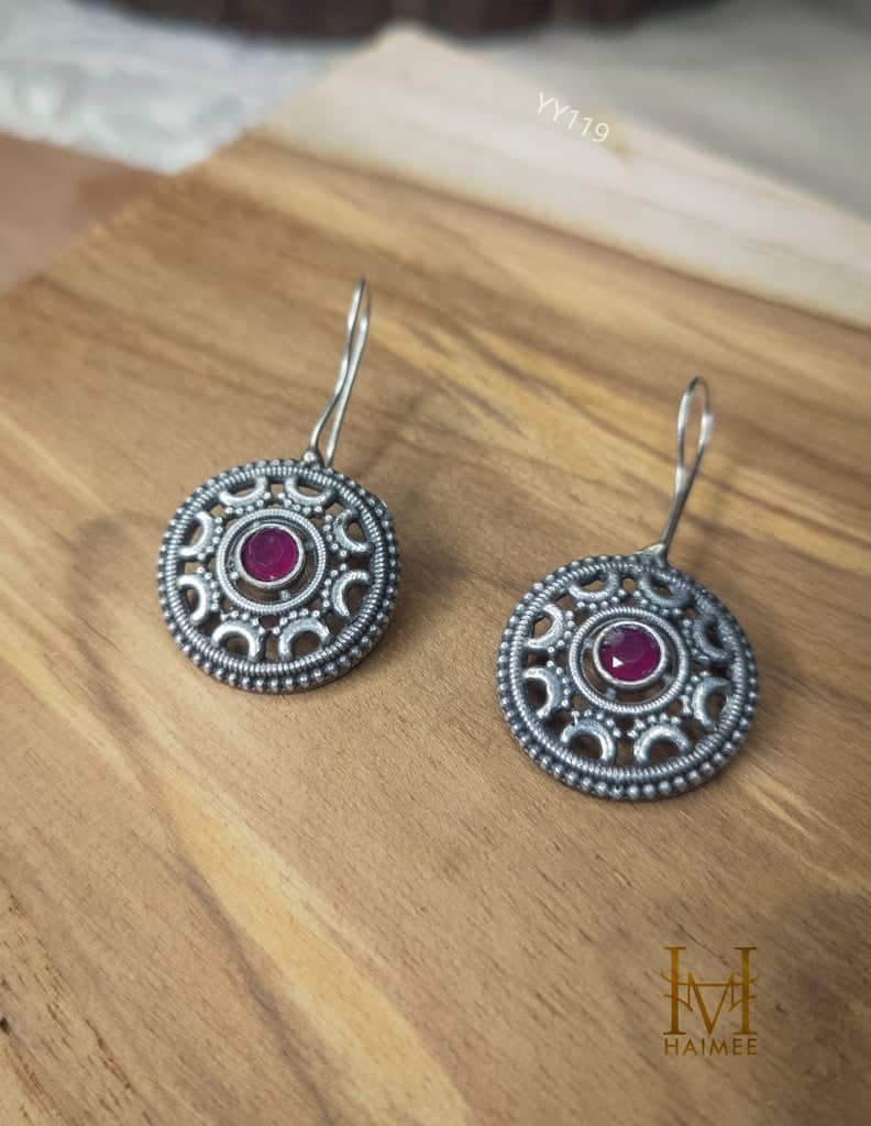 Brass Jewellery, Silver Oxidized earrings with stone placed on wooden surface