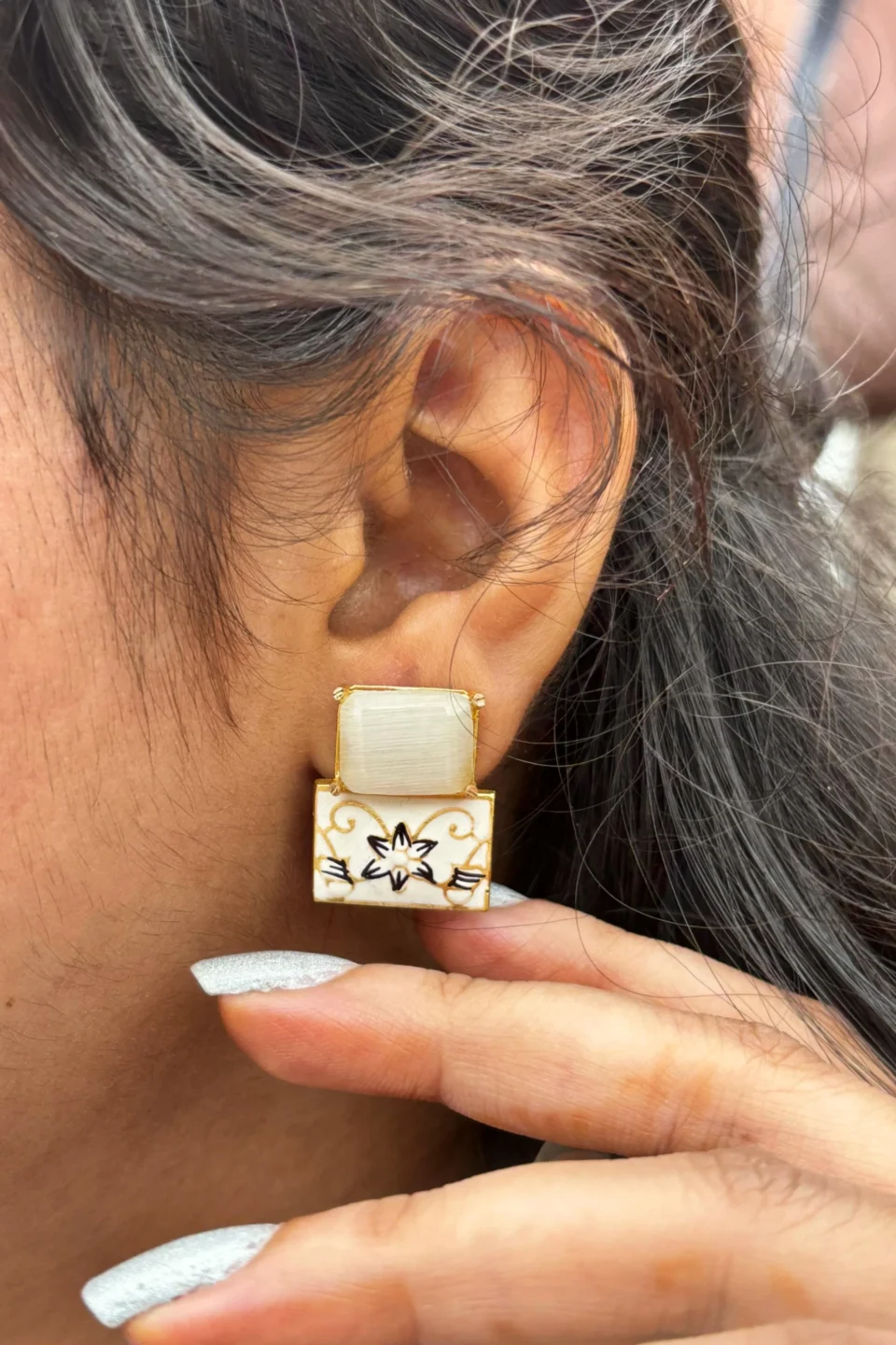 HAND PAINTED EARRING IN EAR