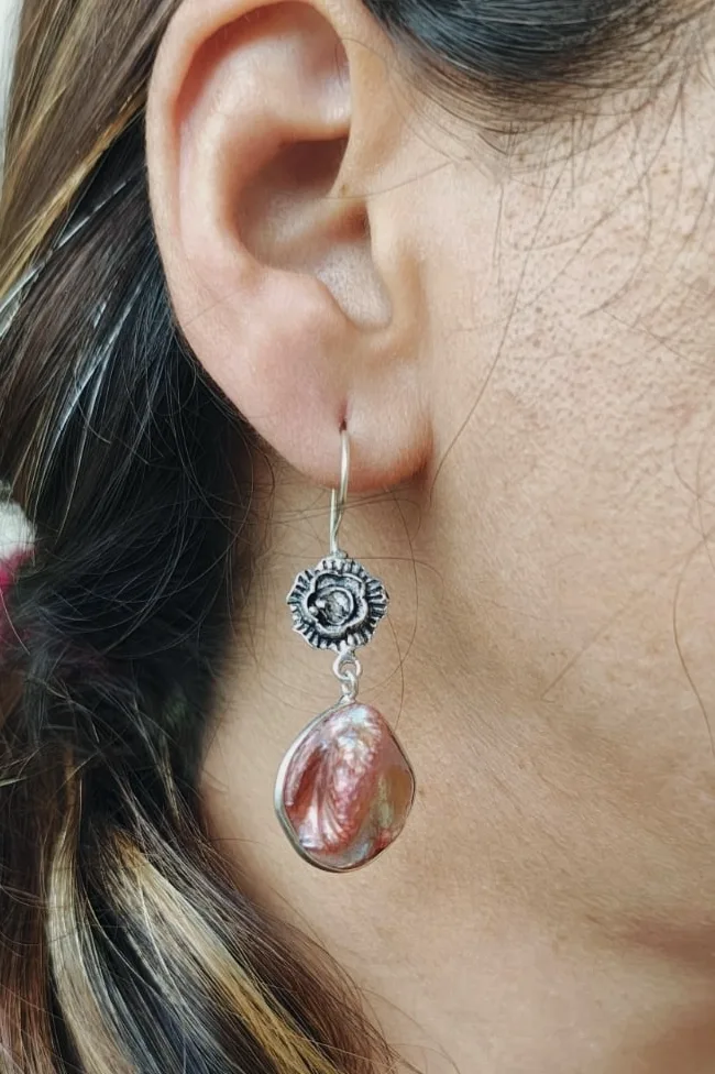 GIRL WEARING EARRINGS