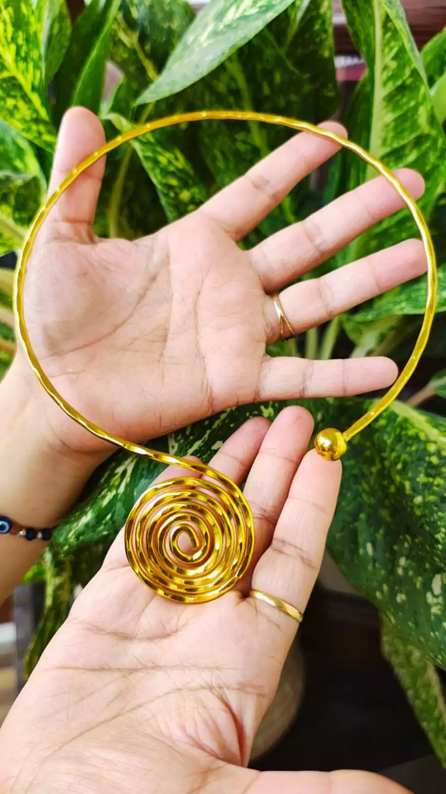 Gold-plated brass collar necklace with large spiral pendant — sculptural statement choker